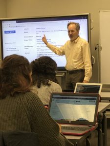 Media studies librarian Tony Doyle takes Macaulay honors students on tour of research resources for their News Literacy course.