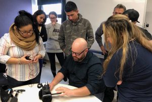 CNN photojournalist Jonathan O’Beirne (seated) with students from Prof. Sissel McCarthy’s Studio News Production class.