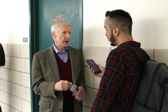 Hunter College journalism student Rich Mendez (at right) interviews CBS News veteran Bob Anderson, following a panel discussion on "60 Minutes" legend Mike Wallace. PHOTO: Kalli Siringas
