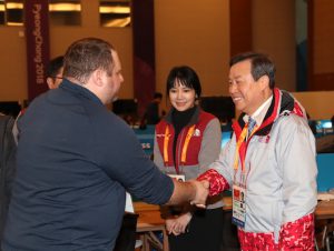 Josh and Do Jong-hwan shaking hands 