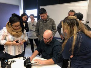 CNN's Great Big Story producer teaching students from the Hunter News Now team how to handle a camera.